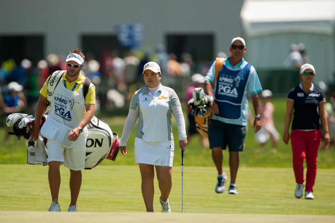 Inbee Park (second left) and her caddie walk down the fairway with  Kim (right) and her caddie during the final round of the 2015 Women's PGA Championship. 