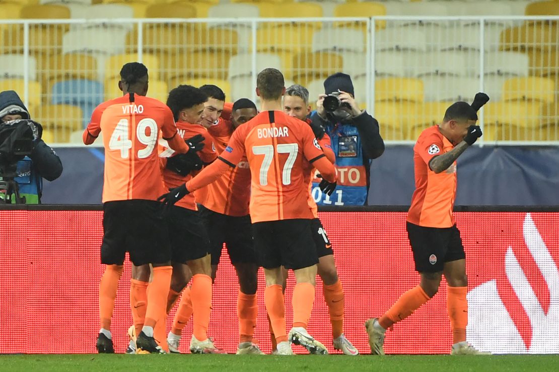 Dentinho celebrates with his teammates after scoring against Real Madrid. 
