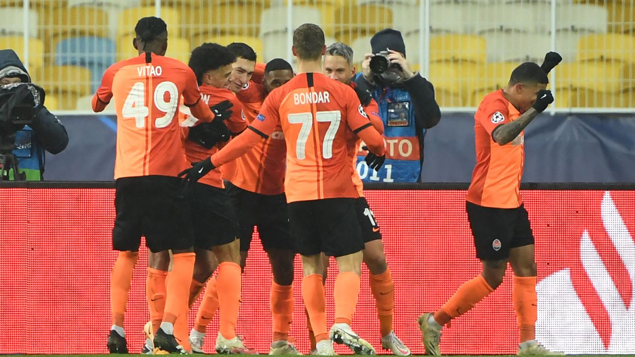 Dentinho celebrates with his teammates after scoring against Real Madrid.