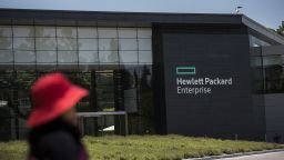 A pedestrian walks past Hewlett-Packard Enterprise Inc. headquarters in Palo Alto, California, U.S., on Monday, May 22, 2016. Hewlett-Packard Enterprise Inc. is scheduled to release earnings figures on after market on May 24. Photographer: David Paul Morris/Bloomberg via Getty Images