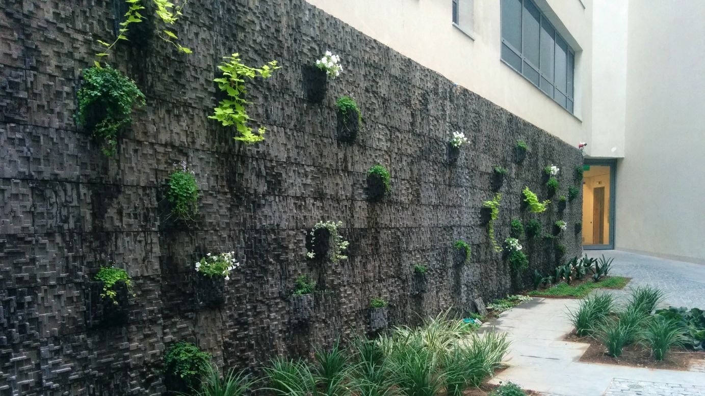 It's <a href="https://edition.cnn.com/style/article/concrete-alternatives-future-building/index.html" target="_blank">bad for the planet</a> but concrete is everywhere in our built environment. What if it grew greenery instead of paving over it? <a href="https://econcretetech.com/econcrete-bio-active-wall-innovative-green-solution/" target="_blank" target="_blank">ECOncrete's</a> bio-enhanced concrete does just that -- supporting vegetation like lichen, moss and climbing plants. Encouraging plant growth on building is about more than just aesthetics: ECOncrete says plant coverage can help to improve air quality and energy efficiency, and reduce noise pollution.   