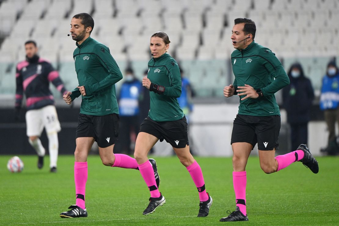 Frappart warms up on the pitch prior to the UEFA Champions League Group G football match between Juventus and Dynamo Kiev.