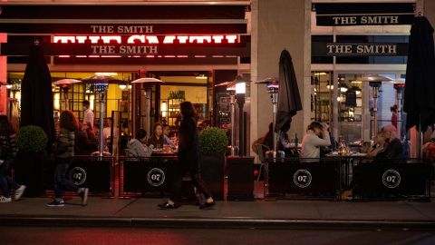 Restaurants and bars in New York, like The Smith, shown above on Thanksgiving day, are among those in a number of states required to close early amid new coronavirus restrictions.