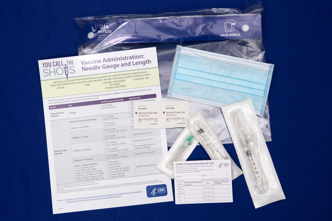 A display shows items that will be provided with Covid-19 vaccines at Operation Warp Speed headquarters in Washington, DC, on November 13.