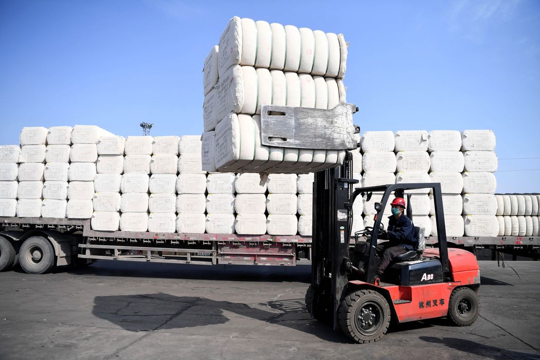 CHANGJI, March 19, 2020 -- A staff member loads cotton at the Asia and Europe international logistics park in Changji, northwest China's Xinjiang Uygur Autonomous Region, March 19, 2020. Enterprises resumed work in an orderly manner at the Asia and Europe international logistics park with measures to prevent infections of COVID-19.(Photo by Sadat/Xinhua via Getty Images)