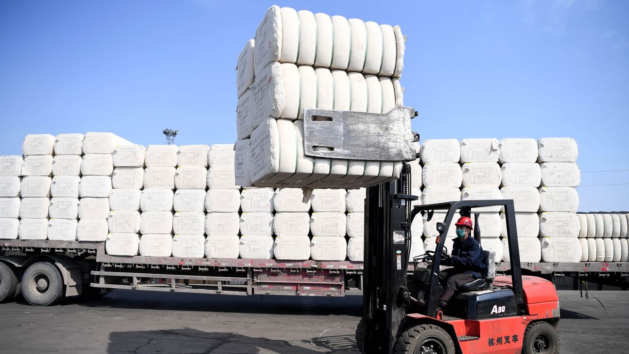 CHANGJI, March 19, 2020 -- A staff member loads cotton at the Asia and Europe international logistics park in Changji, northwest China's Xinjiang Uygur Autonomous Region, March 19, 2020. Enterprises resumed work in an orderly manner at the Asia and Europe international logistics park with measures to prevent infections of COVID-19.(Photo by Sadat/Xinhua via Getty Images)