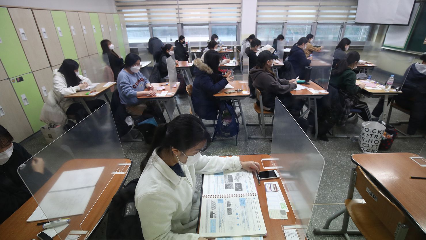 South Korean students take their college entrance exam at a school amid the coronavirus pandemic on December 3, 2020 in Seoul, South Korea. 