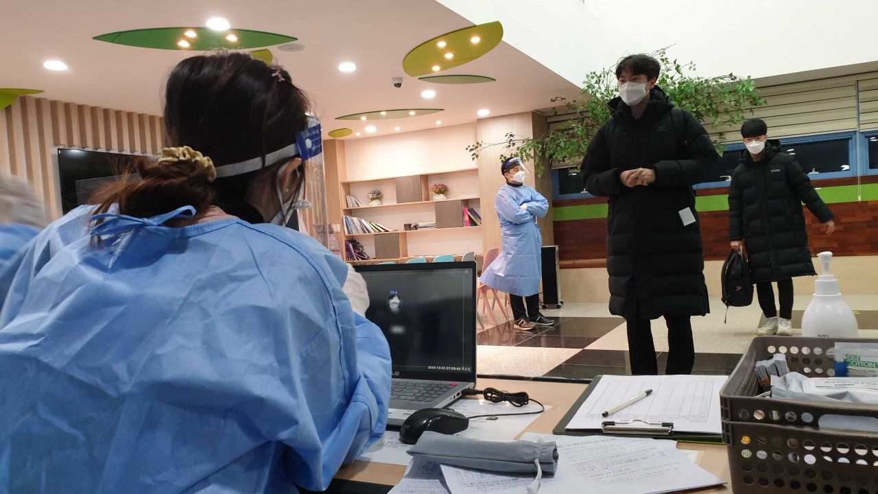 Students prepare to take their college entrance exam with special coronavirus precautions at Dosun High School in Seoul, South Korea on December 3, 2020.