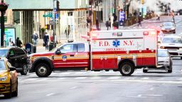 NEW YORK, NEW YORK - MAY 20: An FDNY ambulance drives on Fifth Avenue during the coronavirus pandemic on May 20, 2020 in New York City. COVID-19 has spread to most countries around the world, claiming over 329,000 lives with over 5 million infections reported.  (Photo by Noam Galai/Getty Images)
