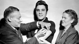 UNITED STATES - OCTOBER 28:  Elvis Presley receiving a polio vaccination from Dr. Leona Baumgartner and Dr. Harold Fuerst at CBS studio 50 in New York City.  (Photo by Seymour Wally/NY Daily News Archive via Getty Images)

Date created:
October 28, 1956