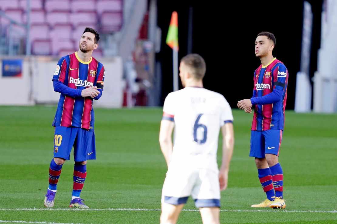 Messi and Dest stand for a minute of silence in tribute to Diego Armando Maradona during the La Liga match between Barcelona and Osasuna.
