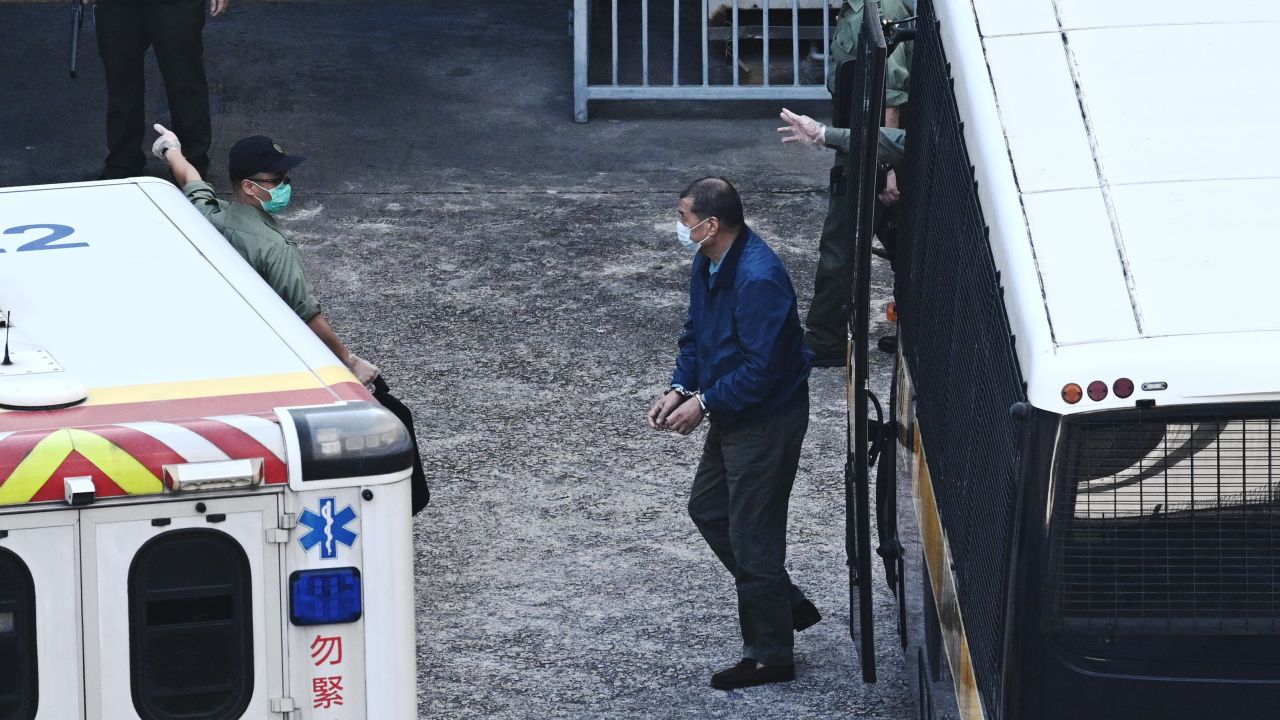 Hong Kong media tycoon Jimmy Lai (C), 73, owner of the Apple Daily newspaper, arrives at Lai Chi Kok Reception Centre after he was remanded into custody in Hong Kong on December 3, 2020, after being charged with fraud.