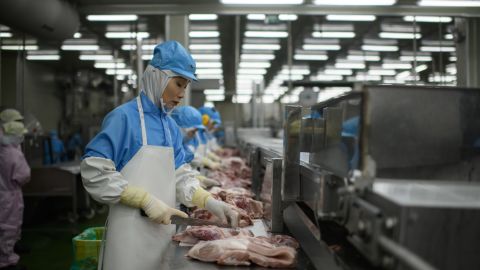 In this photo, taken on August 28, 2018, cuts of meat are processed at a Spam factory in Jincheon, South Korea. 