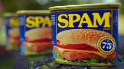 Cans of Spam meat made by the Hormel Foods Corporation are pictured in Silver Spring, Maryland, on July 5, 2012. Hormel's famous canned meat, which was born in Austin, has been a part of American's lives since 1937.  Spam, celebrating its 75th anniversary, its name a hybrid of the words "Spiced" and "Ham," is a canned precooked meat product. AFP PHOTO/Jewel Samad        (Photo credit should read JEWEL SAMAD/AFP/GettyImages)
