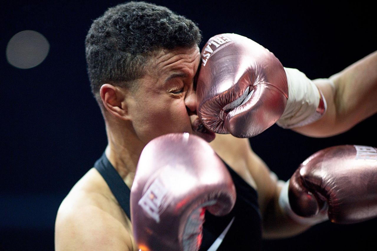 Emilie Beaugeard is punched by Victoire Piteau during a boxing match in Nantes, France, on Friday, November 27. Piteau won to defend her super featherweight title.