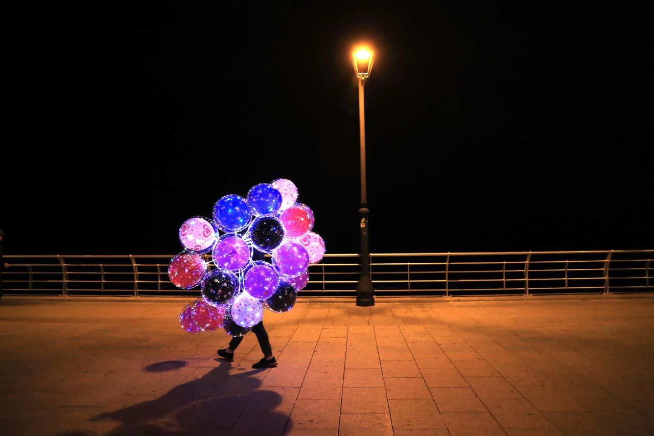 A street vendor sells colored balloons in Beirut, Lebanon, on Wednesday, December 2.