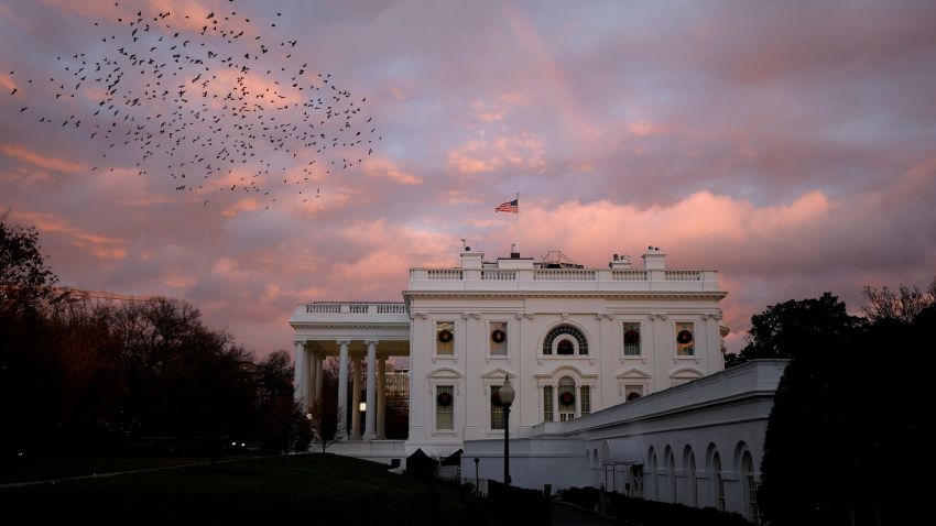 A rainbow appears over the White House as birds fly nearby following a storm in Washington, U.S., November 30, 2020. REUTERS/Tom Brenner     TPX IMAGES OF THE DAY