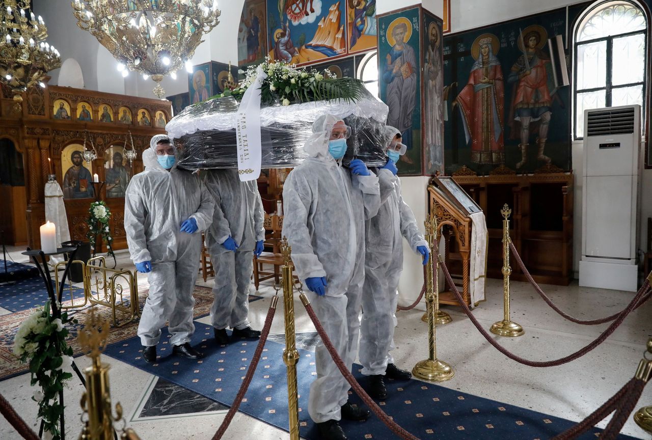 Pallbearers carry the casket of a Covid-19 victim inside a church in Athens, Greece, on Wednesday, December 2.