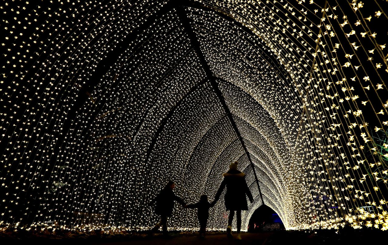 People walk through Christmas lights at the Kew Gardens in London on Tuesday, December 1. <a href="http://www.cnn.com/2020/11/26/world/gallery/photos-this-week-november-19-november-26/index.html" target="_blank">See last week in 36 photos</a>