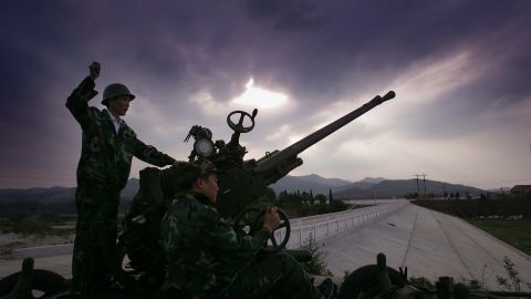 A worker fires rockets for cloud seeding in an attempt to make rain in Huangpi, China on May 10, 2011.
