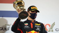 Red Bull's Dutch driver Max Verstappen celebrates with his 2nd-place trophy on the podium after the Bahrain Formula One Grand Prix at the Bahrain International Circuit in the city of Sakhir on November 29, 2020. - Lewis Hamilton powered to victory at the Bahrain Grand Prix on Sunday in a race overshadowed by a horrific crash for French driver Romain Grosjean. (Photo by Bryn Lennon / POOL / AFP) (Photo by BRYN LENNON/POOL/AFP via Getty Images)