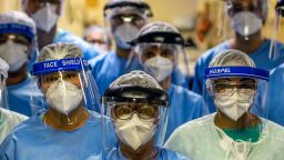 A group of doctors working with patients infected with the novel coronavirus COVID-19 wear face shields at the Intensive Care Unit of the Hospital de Clinicas in Porto Alegre, Brazil, on April 15, 2020. - With Brazilians increasingly ignoring health officials' warnings to stay home -- encouraged by their far-right president Jair Bolsonaro, who has condemned the "hysteria" over the virus -- predictions for how the pandemic will play out in the hardest-hit country in Latin America are getting dire. (Photo by Silvio AVILA / AFP) (Photo by SILVIO AVILA/AFP via Getty Images)