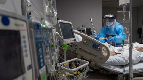 A medical staff member treats a patient in the Covid-19 intensive care unit at United Memorial Medical Center in Houston on November 10.