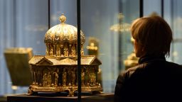 A visitor looks at the the cupola reliquary (Kuppelreliquar) of the so-called "Welfenschatz" (Guelph Treasure) displayed at the Kunstgewerbemuseum (Museum of Decorative Arts) in Berlin, on February 24, 2015. US and British heirs of Nazi-era Jewish art dealers have sued Germany for the return of a mediaeval art treasure worth $250-300 million (220-260 million euros), their lawyers said. AFP PHOTO / TOBIAS SCHWARZ
RESTRICTED TO EDITORIAL USE, TO ILLUSTRATE THE EVENT AS SPECIFIED IN THE CAPTION, NO MARKETING, NO ADVERTISING CAMPAIGNS        (Photo credit should read TOBIAS SCHWARZ/AFP via Getty Images)