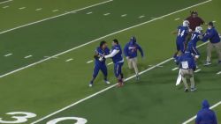 High School Football Player Tackles Ref
