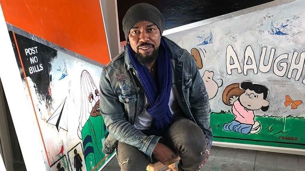 Guy Stanley Philoche with his art.