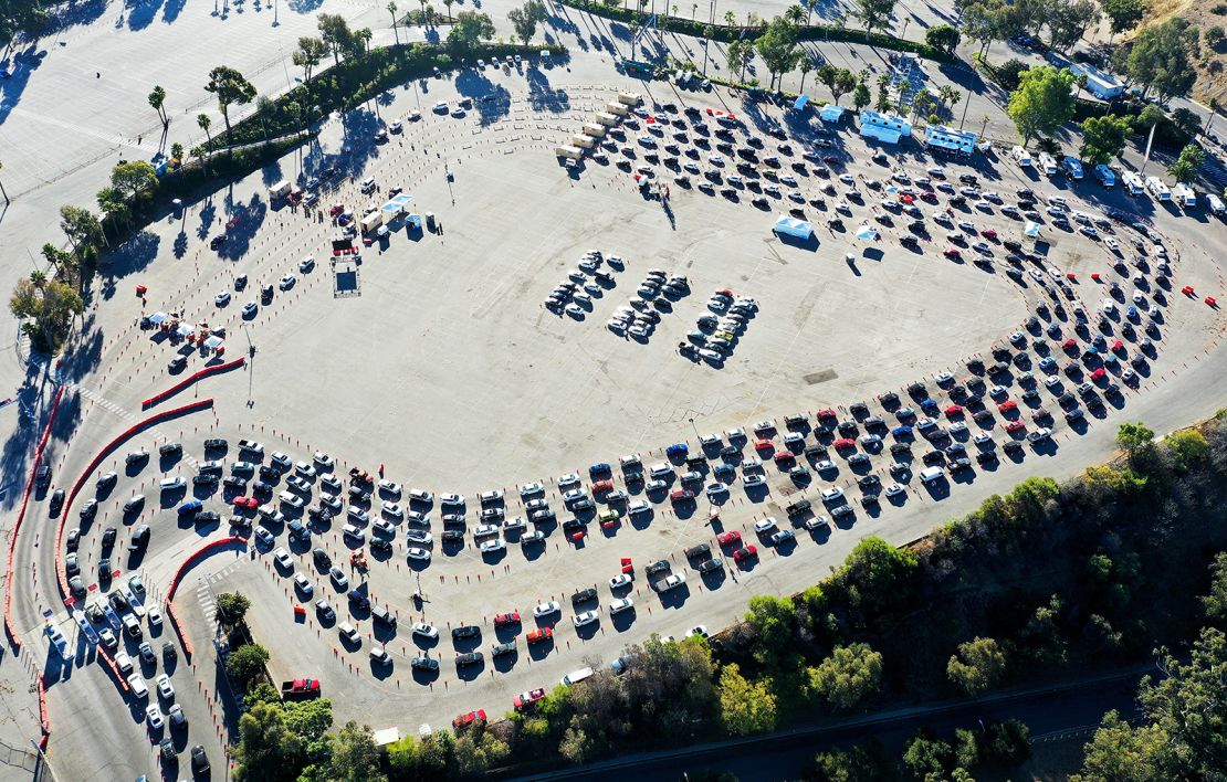 In an aerial view from a drone, cars are lined up at Dodger Stadium for Covid-19 testing on the Monday after Thanksgiving weekend.