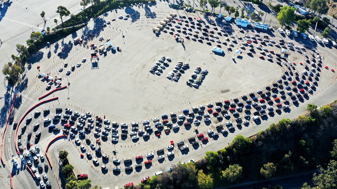 In an aerial view from a drone, cars are lined up at Dodger Stadium for Covid-19 testing on the Monday after Thanksgiving weekend.