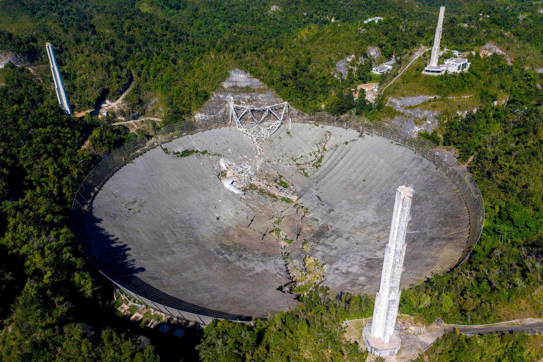 This aerial view shows the damage at the Arecibo Observatory after one of the main cables holding the receiver broke in Arecibo, Puerto Rico, on Dec. 1, 2020.