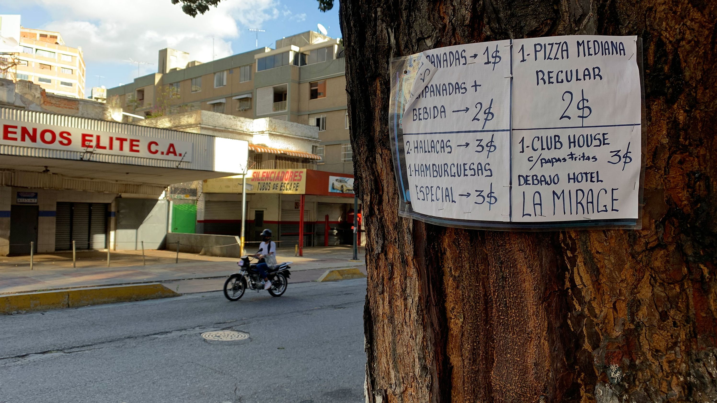 A sign in a Venezuelan neighborhood  illustrates the dollarization of the economy.
