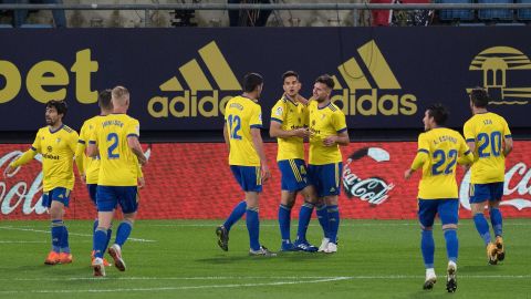 Cádiz players celebrate their opening goal against Barcelona.