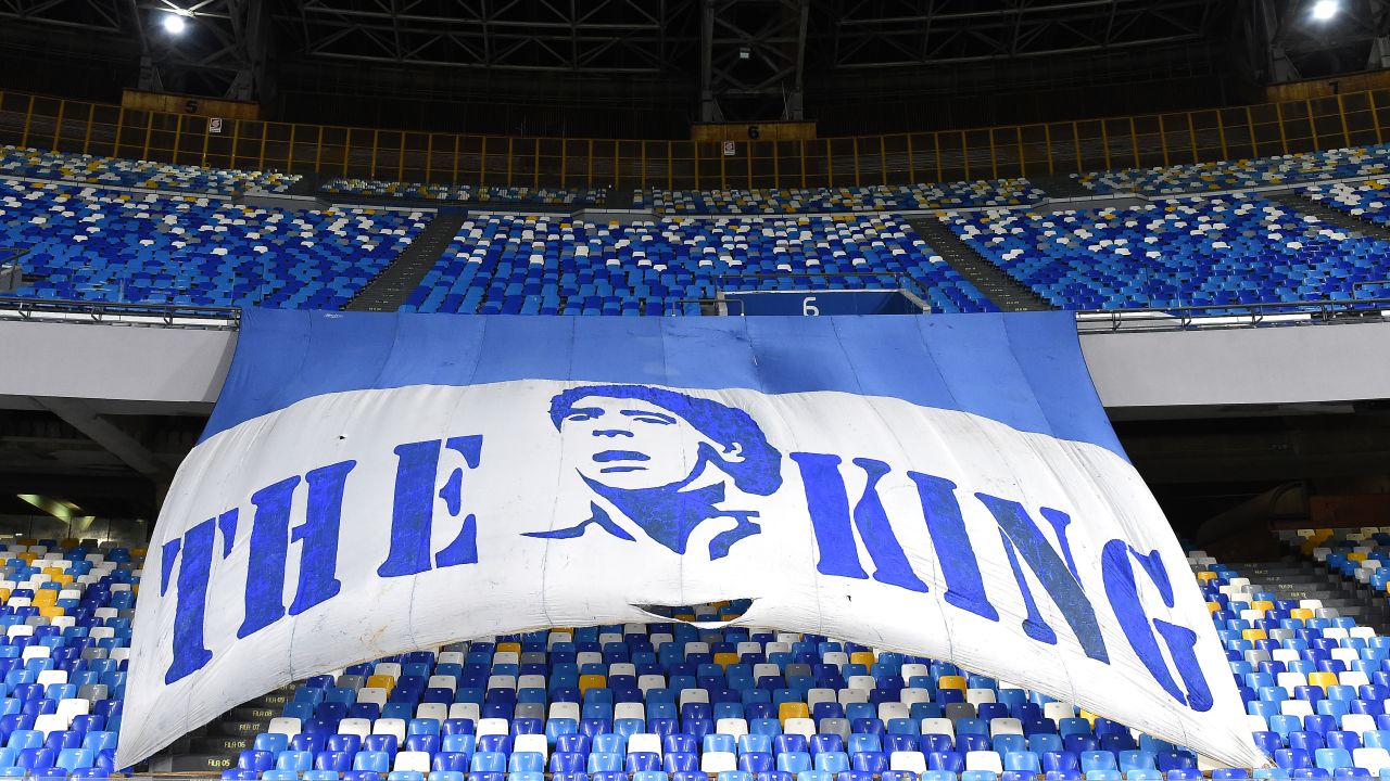 A flag in Napoli's stadium pays tribute to Maradona.