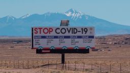 A sign warns against the Covid-19 virus near the Navajo Indian nation town of Tuba City, Arizona in May.