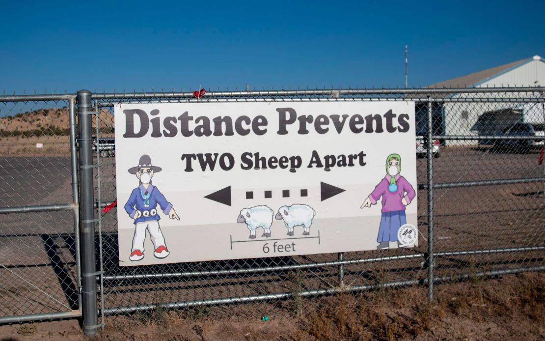 A sign encouraged social distancing outside the Blue Gap Mini Store in Blue Gap, Arizona, on September 24. As Covid-19 swept through the Navajo Nation, signs telling people to socially distance began appearing around the reservation.