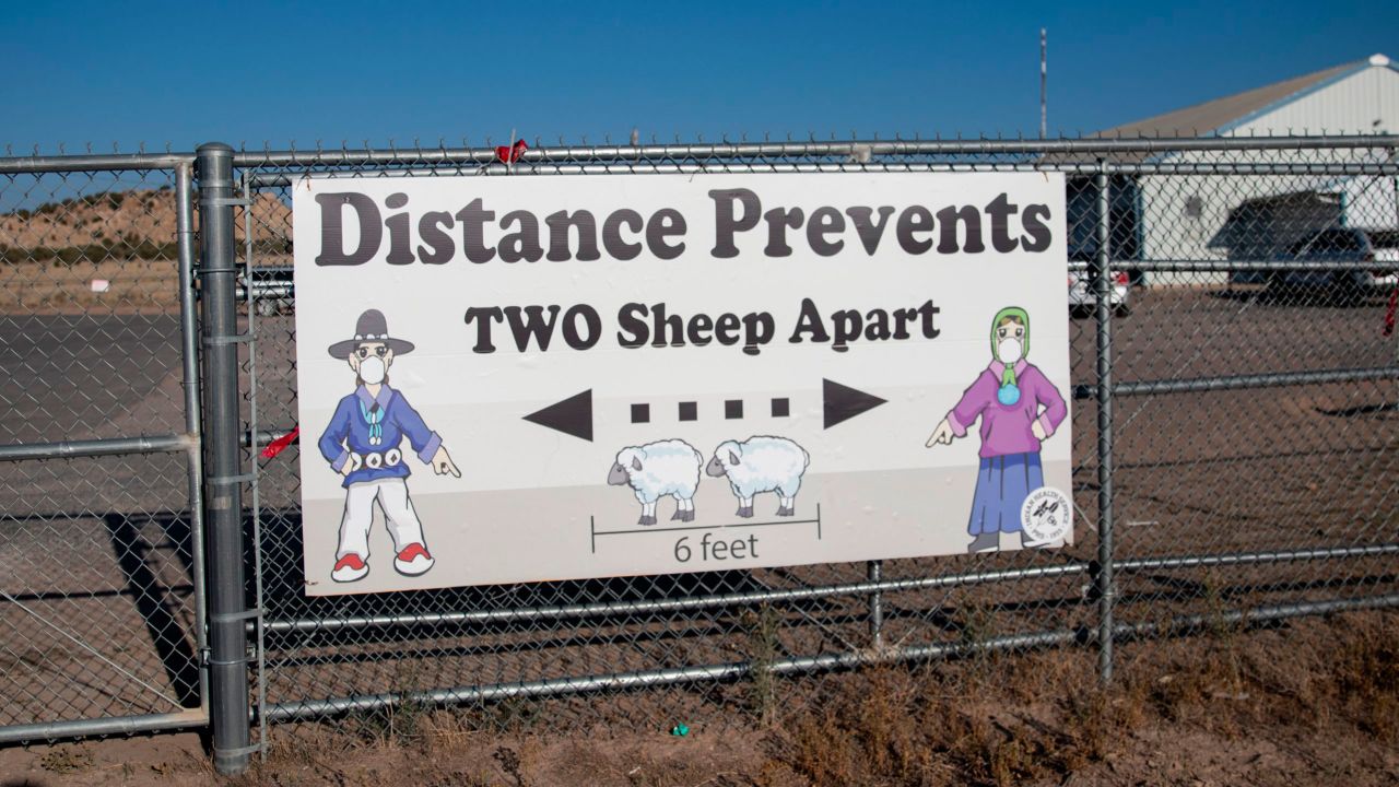 A sign encouraged social distancing outside the Blue Gap Mini Store in Blue Gap, Arizona, on September 24. As Covid-19 swept through the Navajo Nation, signs telling people to socially distance began appearing around the reservation.