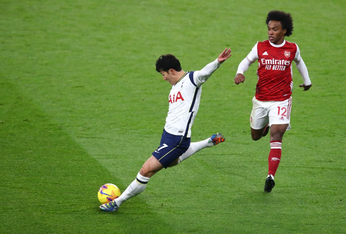 Son scores whilst under pressure from Willian against Arsenal.