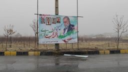 Sunday December 6. A poster of assassinated Iranian nuclear scientist Mohsen Fakhrizadeh, pictured alongside four other Iranian nuclear scientists - from left: Majid Shahriari, Mostafa Ahmadi Roshan, Dariush Rezaei-Nejad, Massoud Ali Mohammadi - who Tehran says have been assassinated previously, stands above the spot where he was gunned down outside Tehran.