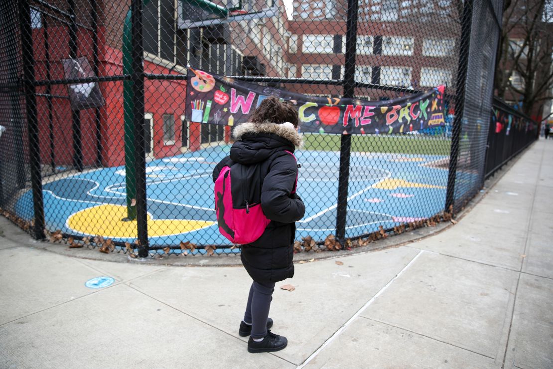 A "Welcome Back" sign greets students Monday as NYC elementary school children returned to classrooms.