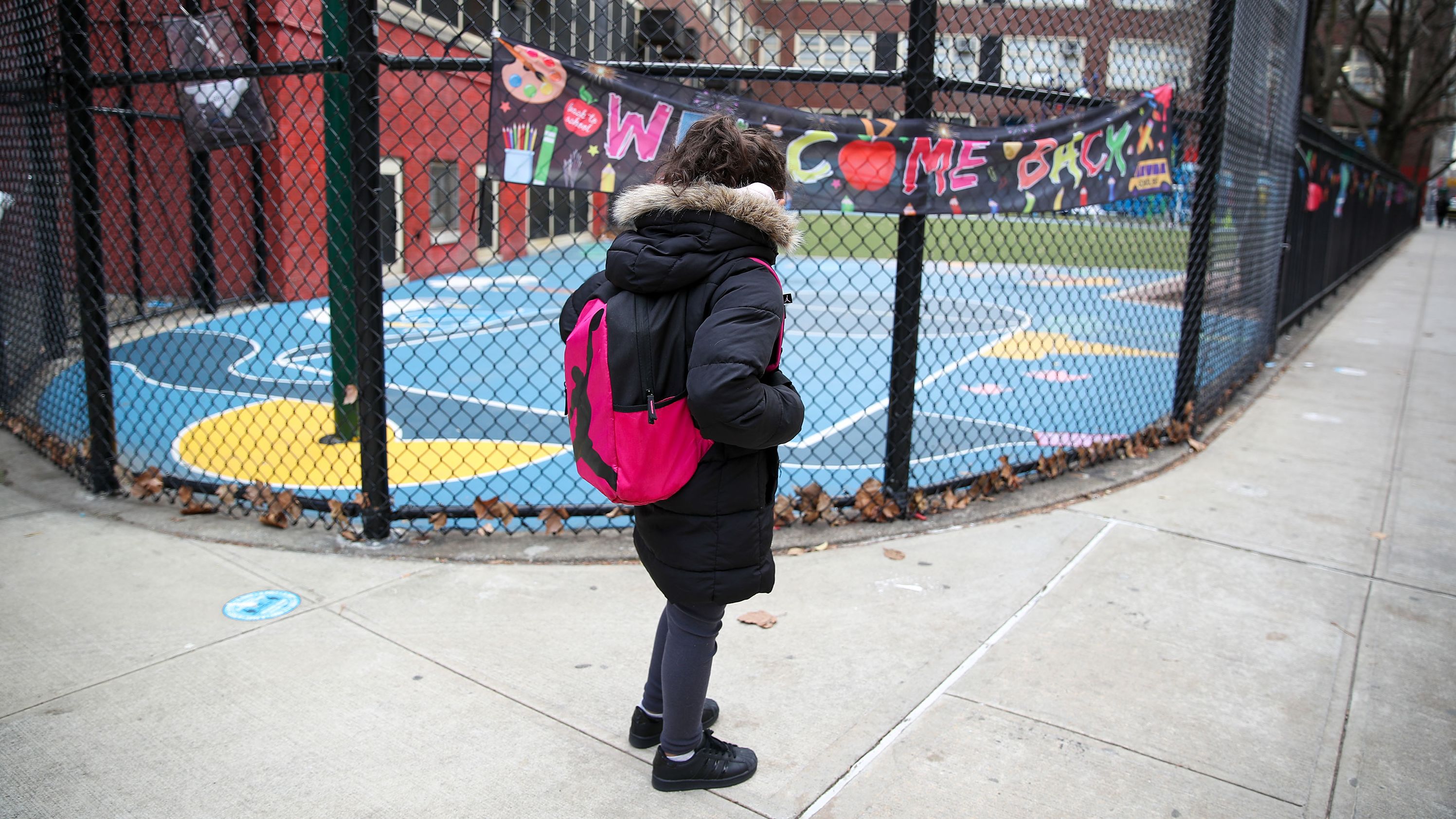 A "Welcome Back" sign greets students Monday as NYC elementary school children returned to classrooms.