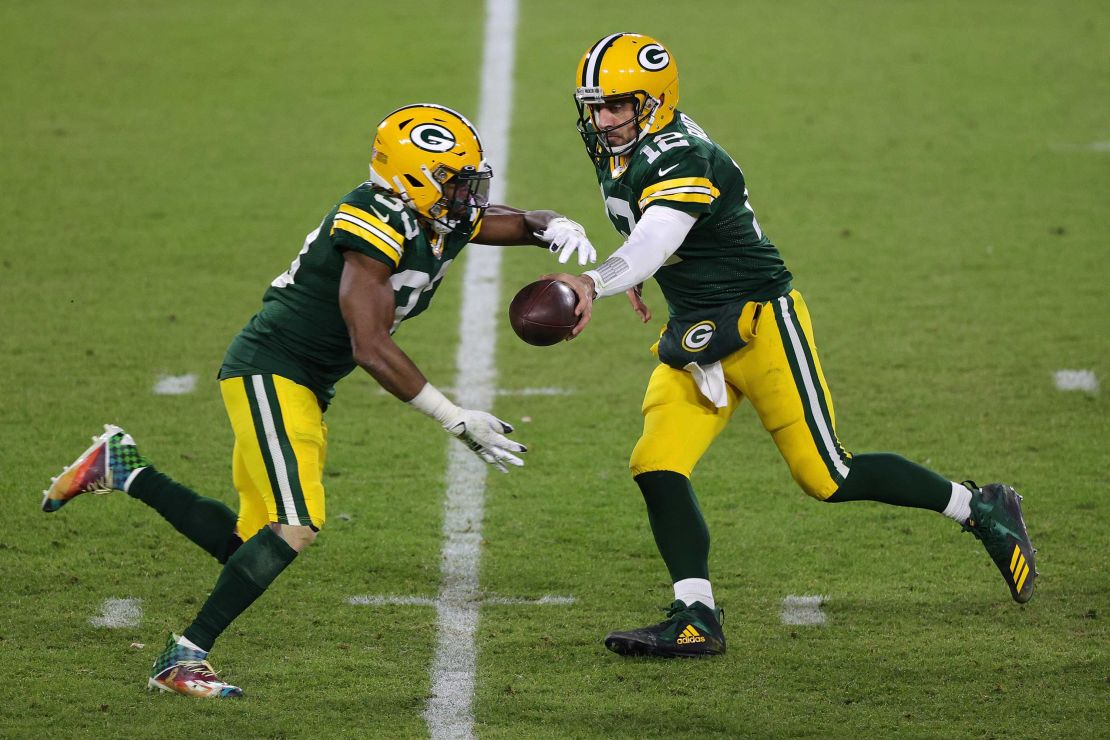 Aaron Rodgers, right, became the quickest quarterback to reach 400 career passing touchdowns on Sunday, doing so in just 193 games.
