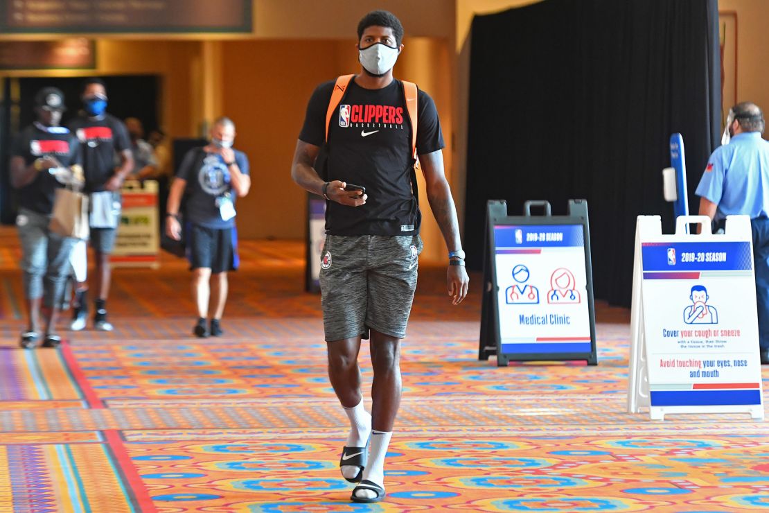 Paul George #13 of the LA Clippers arrives during practice as part of the NBA Restart 2020 on July 21, 2020 in Orlando, Florida. 