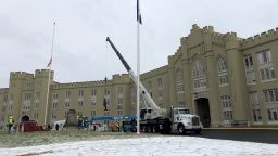 Crews lift a statue of Confederate Gen. Thomas "Stonewall" Jackson from its pedestal on the campus of the Virginia Military Institute on Monday, Dec. 7, 2020, in Lexington, Va. The  military college began work Monday to remove the prominent statue, an effort initiated this fall after allegations of systemic racism roiled the school.(AP Photo/Sarah Rankin)