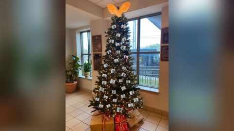 In a now-deleted post, the Mobile County Sheriff's Office shared a picture of a Christmas tree featuring mugshots. CNN blurred parts of the photo to protect identities. 