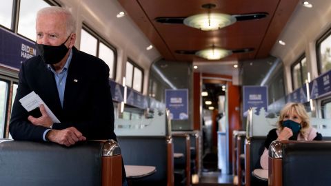 Joe Biden and his wife Jill Biden, right, speaks with invited families aboard an Amtrak train, Wednesday, September 30, 2020, as it makes its way to Alliance, Ohio.