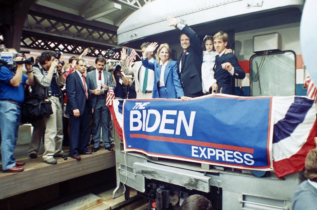 In this June 9, 1987 file photo, Sen. Joe Biden waves from his train as he leaves Wilmington, Del., after announcing his candidacy for president. At right, son Beau carries daughter; to Biden's right is his wife Jill and son Hunt. 
