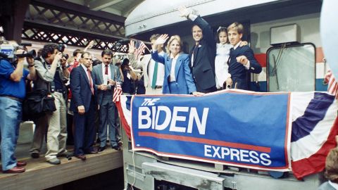 In this June 9, 1987 file photo, Sen. Joe Biden waves from his train as he leaves Wilmington, Del., after announcing his candidacy for president. At right, son Beau carries daughter; to Biden's right is his wife Jill and son Hunt.
